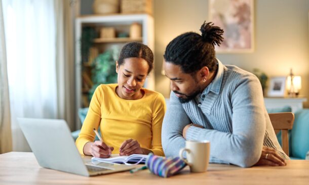 Father,And,Daughter,Doing,Homework,With,Laptop,At,Home.,Father